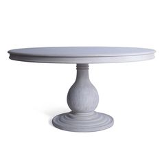 a white cake plate sitting on top of a table