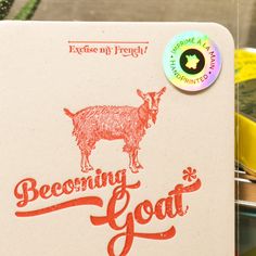 a close up of a book with a goat on it's cover and the words becoming goat written in red