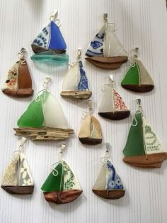 a group of small sailboats sitting on top of a table