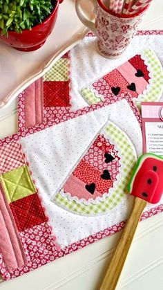 a table topped with pink and green items