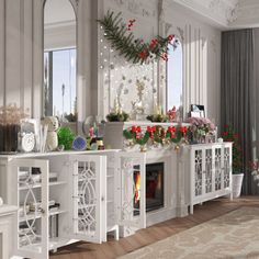 a living room filled with white furniture and flowers on top of a fireplace mantel