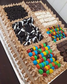 there are many different types of candies on this cake