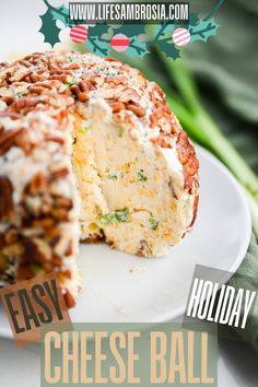 a cheese ball is cut in half on a white plate with the words easy holiday cheese ball