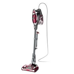 a red and silver vacuum cleaner on a white background