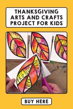 a hand holding scissors next to some art and crafts project for kids with words on it