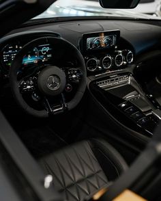 the interior of a mercedes benz sports car