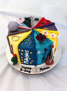 a birthday cake decorated with many different items