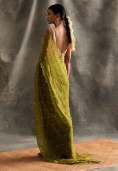 Editor's Note Pure Crepe Floor Length Kaftan With Handmade Lampi Triangles Embroidered All Over As Well As Edged At The Border Fabric: Crepe Color: Olive Green Care: Dry Clean Only About the Designer Itrh makes a high-end luxury Indian ethnic wear made using exquisite and endangered age-old crafts such as kalamkari, madhubani, chikankari, zardozi, and gota weaving. The focus of the house is to cherish the beauty of handcrafted luxury designer wear. Green Embellished Pre-draped Saree For Wedding, Embellished Green Chanderi Dupatta, Embellished Organza Saree, Designer Green Embellished Saree, Embellished Organza Saree Floor-length, Floor-length Embellished Organza Saree, Embellished Floor-length Organza Saree, Green Semi-stitched Embellished Saree, Semi-stitched Green Embellished Saree