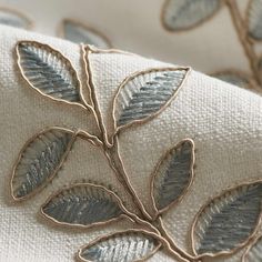 a close up view of the fabric with leaves on it