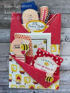 a close up of a paper bag on a wooden surface with words and pictures in it