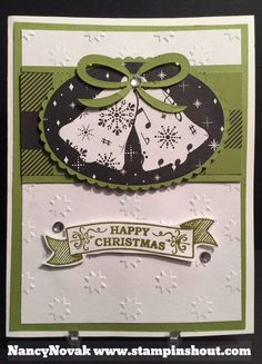 a christmas card with two bells on it and a ribbon around the corner that says happy christmas