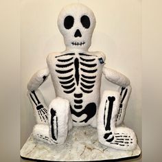 a fake skeleton sitting on top of a table