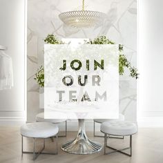 a table with two stools and a sign that says join our team