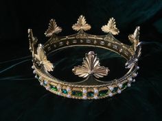 New for 2022! This design was made at the request of a client for an English ducal coronet. I took inspiration from various ducal coronets and heraldic drawings to produced this one. I am offering 2 sizes, a 24 inch circumference with 8 leaves, and a 21 inch circumference with 7 leaves. Padding maybe added inside to reduce the size. The cornet is made of metal alloy embellished with rhinestones and faux pearls. I have a few cabochons if you would like an earlier time period look. Please message Flower Stationary, King And Queen Crowns, Strawberry Leaves, Mermaid Aesthetic, Queen Crown, Time Period, Tiaras And Crowns, Attack On Titan Anime, Underworld