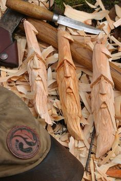 an assortment of wood shavings and tools on the ground