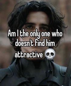 a guy with long hair and a skull on his shoulder, says i am the only one who doesn't find him attractive