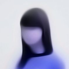 a blurry image of a woman's head in blue and white colors,