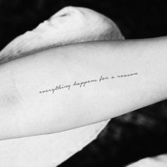 a woman's arm with the words everything happens for a reason written on it