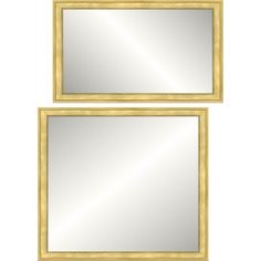 two gold framed mirrors sitting next to each other