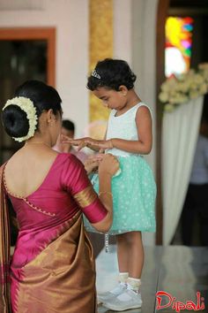 What a beautiful large large low bun with real flower gajra! Care however should be taken before adopting such hairstyles, as due to it's high static charge, it will cause phlegm to move up in the throat, causing the voice to quaver & a frequent urge to clear the throat. A heavy chabi chhalla with a long & wide hook if inserted at the edge of the pleats of the saree, will reduce this problem as it's hook will activate the acupressure points that act to keep the throat clear. Oonjal Saree, Low Neck Blouse, Latest Blouse Back Neck Design, Flower Gajra, Blouse Back Neck Design, Back Neck Design, Silk Saree Blouse Designs Patterns, Blouse Back Neck