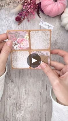 someone is making a card with flowers and laces on the inside, while another person's hands are holding it