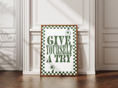 a green and white poster with the words give yourself a try in front of it