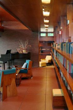 a library filled with lots of books and furniture