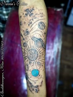 an arm with planets and stars on it