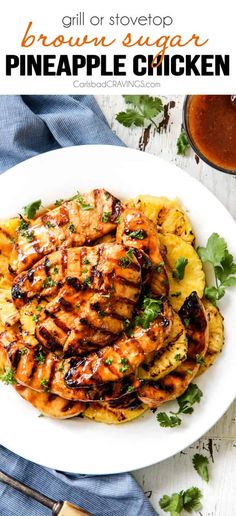 grilled pineapple chicken on a white plate with garnish and parsley