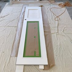 the door is being painted white and green