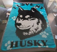 a blanket with an image of a husky on it