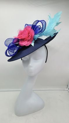 Beautiful large blue fascinator adorn with sky blue feathers and and hot pink  flowers. Style to go with a variety of outfits: bridesmaids,  cocktail party,  Kentucky Derby, Rehearsal dinner, Easter and church outfits.  Ones with hair clip and headband. Are you trying to match an outfit? Send a picture and I will help you find a best hat to match your outfit.  - Rare find - Ready to ship  - Lightweight - Free Shipping - Fast shipping - Customize by adding different color flowers and or feathers Check my store for for styles and colors.  etsy.com/shop/hatsandpearls Find more at my website: Www.hatsandpearls.com  reach out to me if you can't find what you are looking for.  I can make cake custom orders and help you style and match your outfit  Thank you for visiting! Blue Feather Fascinator For Summer, Blue Hats With Handmade Flowers For Kentucky Derby, Blue Feathered Fascinator For Summer, Blue Mini Hats With Handmade Flowers For Royal Ascot, Blue Feathered Summer Fascinator, Spring Blue Mini Hats With Handmade Flowers, Summer Blue Headpiece With Handmade Flowers, Blue Hats With Handmade Flowers For Royal Ascot, Blue Fascinator With Handmade Flowers For Kentucky Derby