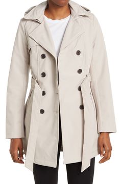 Keep off the wind and rain in this water-resistant softshell trench coat featuring a removable hood, tie waist and secure zip pockets. 32 1/2" length (size S) Water- and wind-resistant Removable hood Notched collar Long sleeves Double-breasted closure Tie belt Front zip pockets Softshell construction Partially lined Shell/lining: 100% polyester Machine wash, line dry Imported Model stats: 5'10" height, 32" bust, 25" waist, 36" hip. Model is wearing size S. Latinx Owned and Founded Petite Trench Coat, Double Breasted Trench Coat, Wind And Rain, Sharp Dressed Man, Short Coat, Notched Collar, Tie Belt, The Wind, Double Breasted