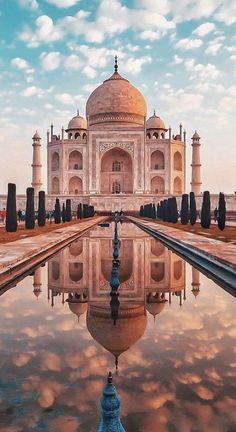 an image of the tajwa in india with its reflection on the water surface