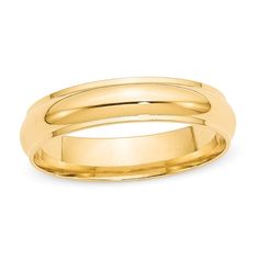 a yellow gold wedding ring on a white background