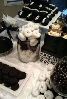 a table topped with lots of different types of cookies and desserts on top of it