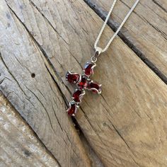 "Beautiful garnet cross necklace...1 1/2\" tall with bail by 3/4\" wide at the widest spot, cast in sterling silver 925 with six 5mm by 7mm oval shape garnet stones...the chain is 18\" long also in sterling silver 925 with a lobster catch, all the garnet stones a very well matched...the regular price is $91.00..sale price $74.00" Red Sterling Silver Cross Necklace, Red Cross Necklace In Sterling Silver, Feather Ring, Garnet Stone, Dragon Pendant, Nerd Alert, Stunning Jewellery, Amethyst Stone, Amethyst Ring