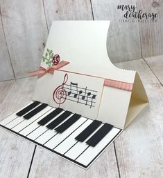 an open card with music notes on it