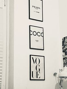 three black and white photographs hanging on the wall