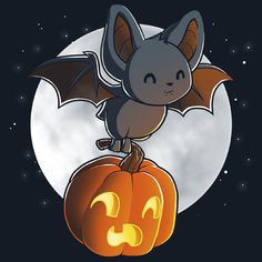 a bat sitting on top of a pumpkin