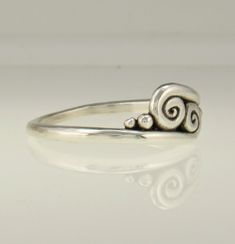 Sterling Silver Scroll Ring/ Silver Wave Ring/ Double Swirl Ring/ Silver Swirl Ring/ One of a Kind Ring/ Silver Thumb Ring/ Handmade Ring R1198- Sterling Silver Handmade One of a Kind ring. The scrolls or swirls give it a Victorian or Egyptian feel. Comfortable Low Profile One of a Kind Ring. It is a size 9. I can size it to fit, just contact me. No charge to size down, and no charge for one size up. Would make a nice Thumb Ring. The top of the ring measures 8 mm and the band is 2 mm. This ring Elegant Sterling Silver Ring With Artistic Design, Unique Spiral Rings For Anniversary, Modern Twist Swirl Ring For Gift, Modern Twist Swirl Ring As Gift, Modern Twist Swirl Ring For Gifts, Spiral Sterling Silver Wedding Ring, Sterling Silver Swirl Rings For Gift, Hand Forged Spiral Ring As Gift, Hand Forged Spiral Ring For Gift