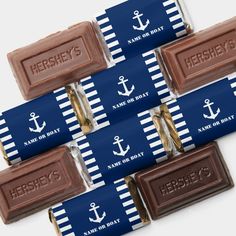 four personalized chocolate bars with an anchor on them