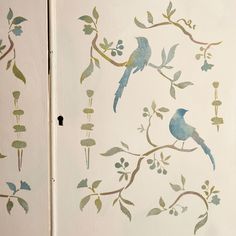 two birds are sitting on the branch of a tree painted with watercolors and ink