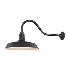 a black wall light with a white shade on the side and an arm that is attached to