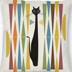 a black cat sitting on top of a pillow with multicolored lines in the background