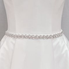 Bridal Rhinestones Belts, Bridal Belt Rhinestone, Rhinestone Bridal Belt, Wedding Belts for Brides This slender crystal-adorned Bridal Rhinestones Belts will add a subtly beautiful shine to your wedding dress. 💖 Details - Embellishment measures 17 inches long and .7 inches wide - Finished with soft ivory organza, measures 108 inches long - Handmade with sparkling crystals 💖 Packaging Each accessory is delicately packaged in our exclusive soft and luxe velvet bag, ensuring its pristine condition until your special day. 💖 Shipping This item is currently in stock, and will be shipped within 2 business days from NY 💖 Returns & Exchanges At bridal accessories shop, we understand that planning your dream wedding can be a whirlwind, your desire to look like the most beautiful bride in the wor White Crystal Bridal Sets With Sparkling Stones, Silver Bridal Sets With Rhinestones For Wedding, White Cubic Zirconia Bridal Accessories For Wedding, Silver Bridal Sets With Rhinestones For Party, Silver Embellished Bridal Accessories For Ceremony, Bridal Rhinestone Necklace For Wedding, Diamond Bridal Necklace With Rhinestones For Wedding, Elegant Bridal Sets With Crystal Stone Work, White Diamond Bridal Necklace With Rhinestones