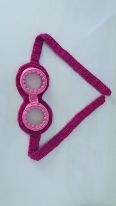 a pair of glasses made out of crochet