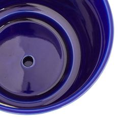 a blue bowl is shown on a white background