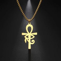 The ankh is an ancient Egyptian symbol that was most commonly used in writing to represent the word for "life" and, by extension is a symbol for life. This ankh necklace is made of solid 316L surgical stainless steel and has a high polish gold color PVD finish with the eye of Ra or Horus in the center. This amulet is reversible so that it may be worn as the eye of Ra or Horus. The Eye of Ra is a symbol of the sun. It is personified by several Egyptian goddesses, such as Wadjet, Sekhmet, Hathor, Egyptian Amulet, Eye Of Horus Necklace, Ankh Necklace, Egyptian Inspired, Black Unicorn, Baby Black, Child Baby, Mens Jewelry Necklace, Eye Of Horus