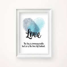 a white frame with a blue fingerprint and the words love on it in black lettering